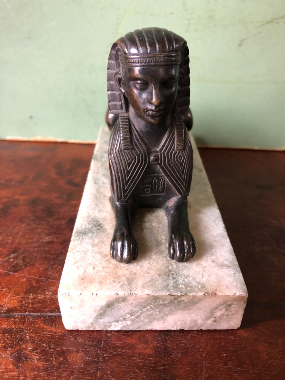Early C19th bronze sculpture study of a Sphinx mounted on a ‘verde mare’ marble base. View II