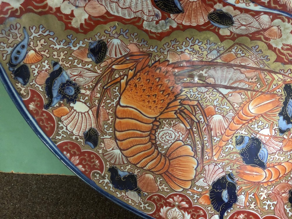 Fine large late C19th Japanese Meiji period porcelain charger in the Imari palette . View II