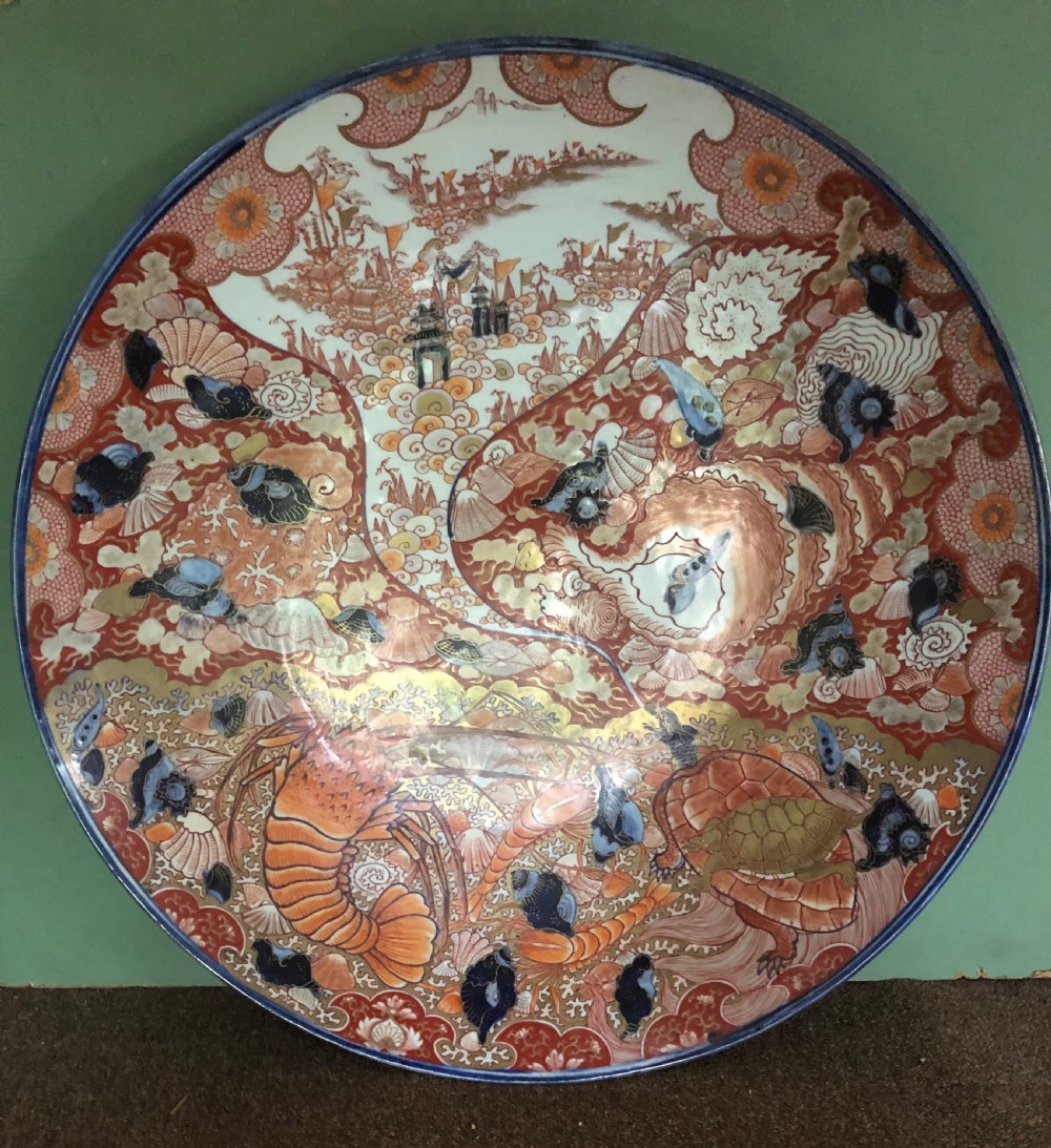 Fine large late C19th Japanese Meiji period porcelain charger in the Imari palette . View III