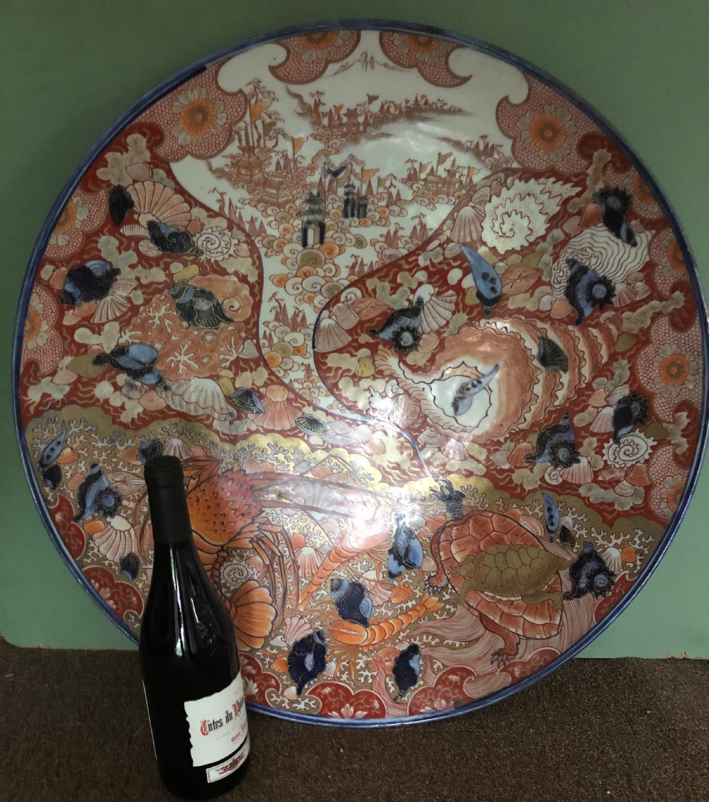 Fine large late C19th Japanese Meiji period porcelain charger in the Imari palette . View XII