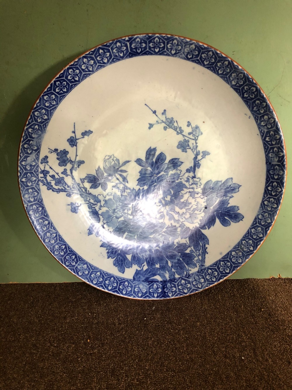 Late C19th Japanese Meiji period Arita porcelain charger with blue and white floral decoration. View II