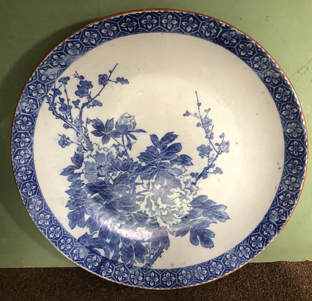 Late C19th Japanese Meiji period Arita porcelain charger with blue and white floral decoration. View VII
