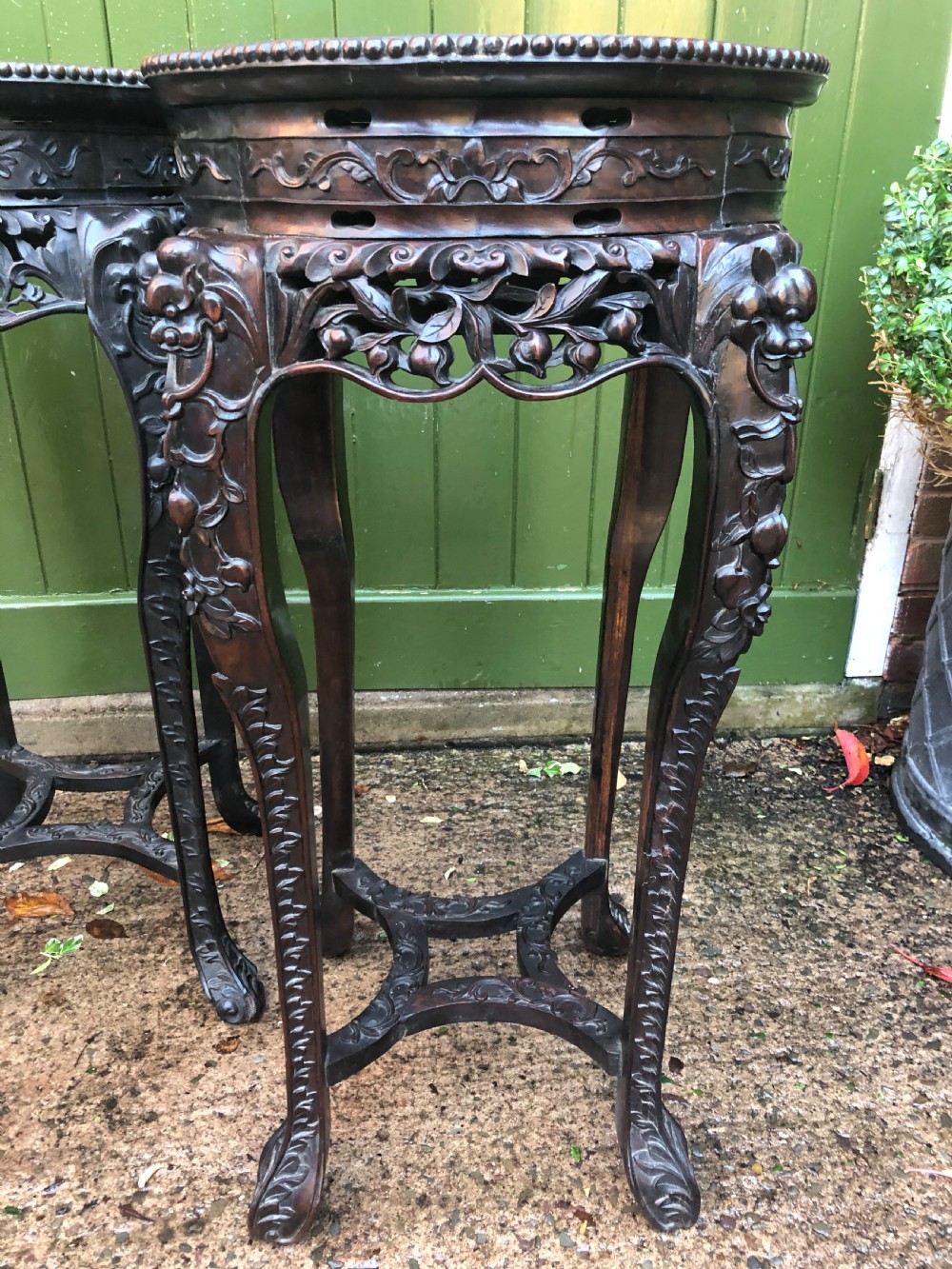 Large-scale matched pair of late C19th Chinese Qing Dynasty carved hardwood urn stands . View III