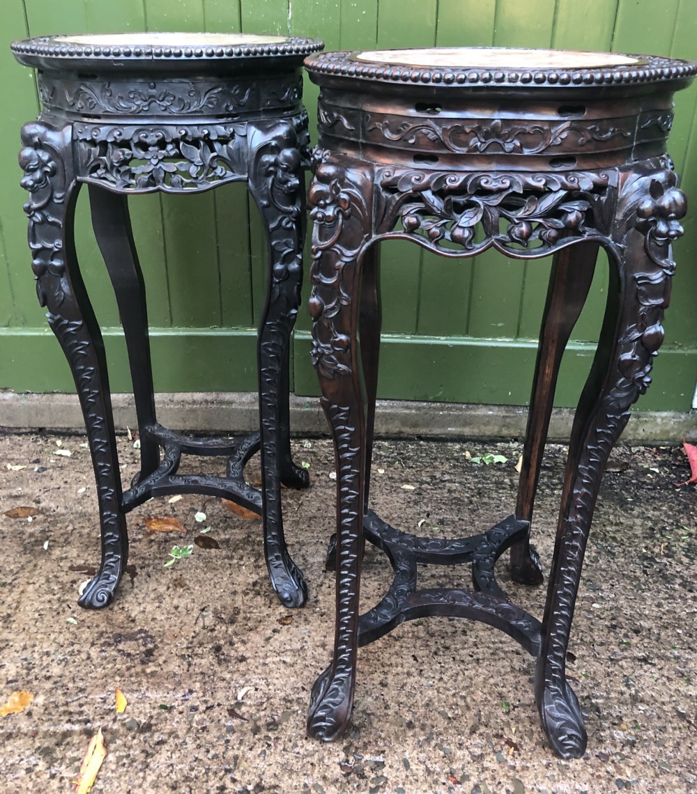 Large-scale matched pair of late C19th Chinese Qing Dynasty carved hardwood urn stands .