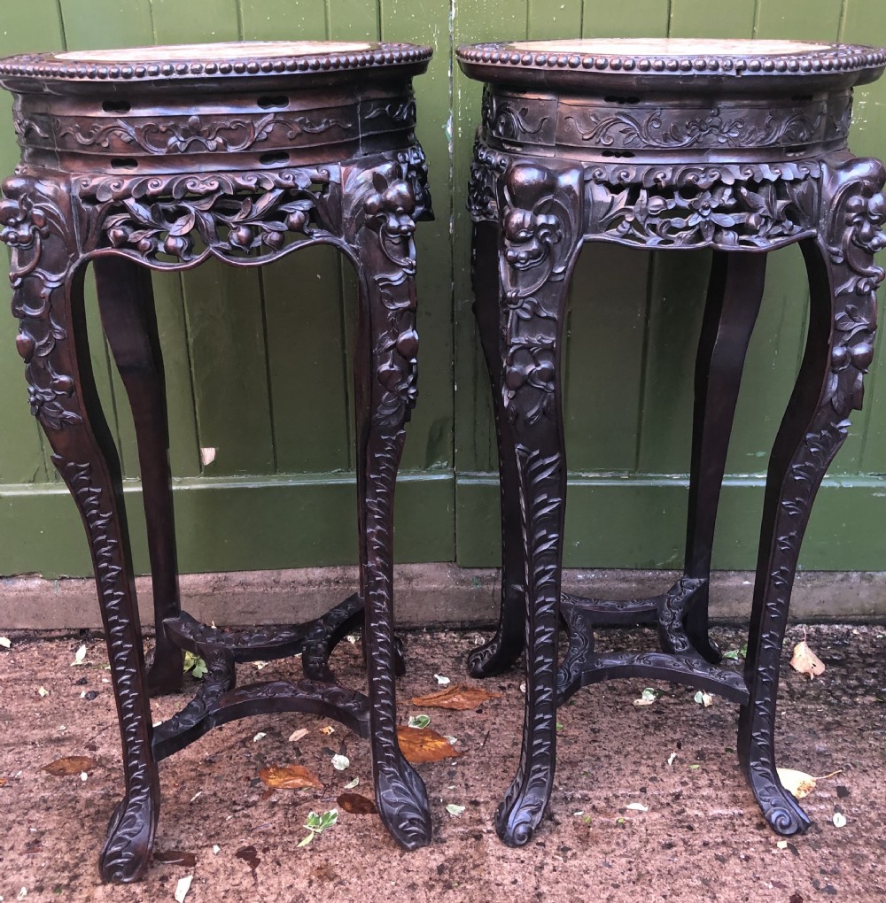 Large-scale matched pair of late C19th Chinese Qing Dynasty carved hardwood urn stands . View V