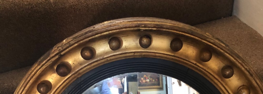 Early C19th Regency period gilt-wood framed convex mirror. View III