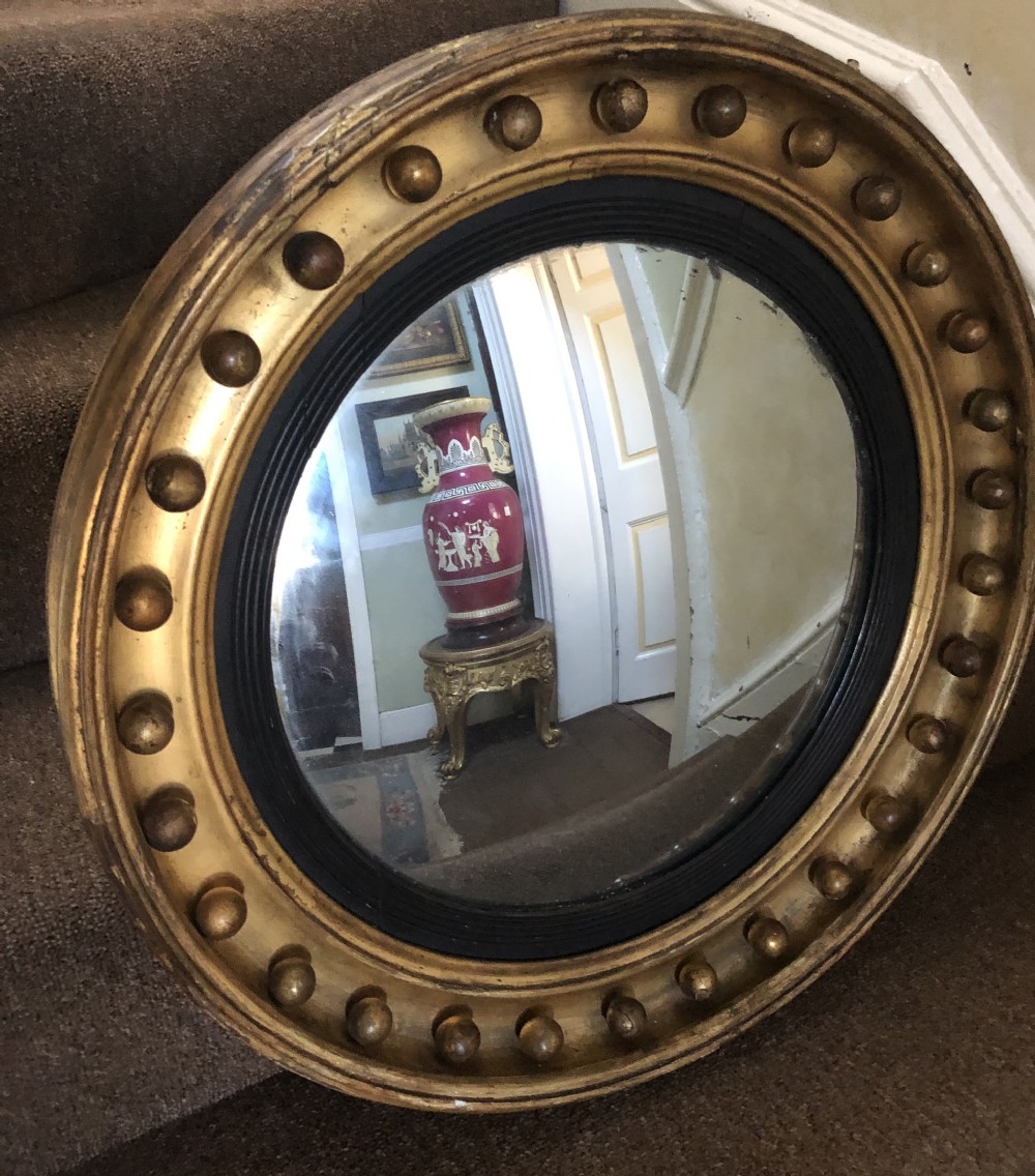 Early C19th Regency period gilt-wood framed convex mirror. View II