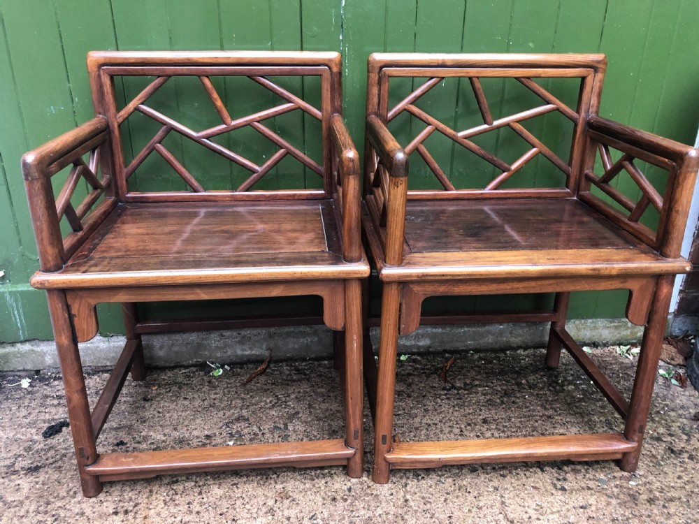 Pair of late C19th Chinese Qing Dynasty hardwood armchairs of unusual design.