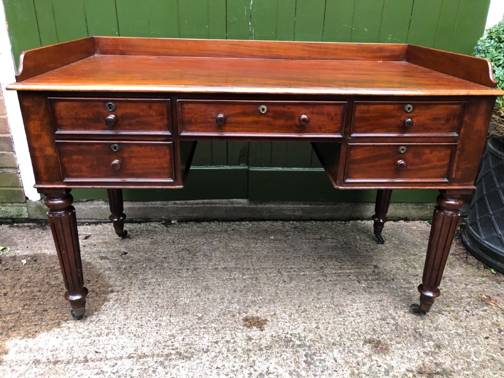 Early C19th George IV period mahogany kneehole writing table in the manner of Gillows of Lancaster and London. View III