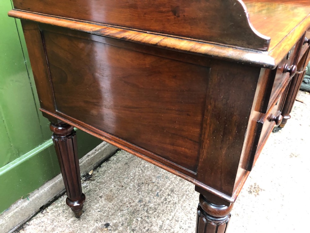 Early C19th George IV period mahogany kneehole writing table in the manner of Gillows of Lancaster and London. View IV