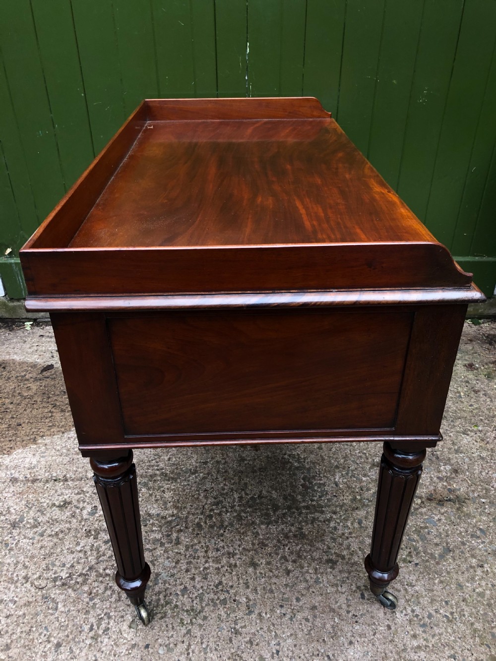 Early C19th George IV period mahogany kneehole writing table in the manner of Gillows of Lancaster and London. View V