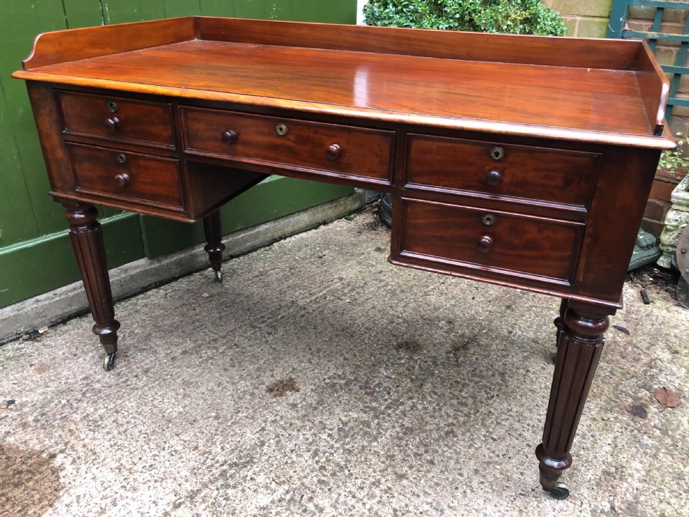 Early C19th George IV period mahogany kneehole writing table in the manner of Gillows of Lancaster and London. View VIII
