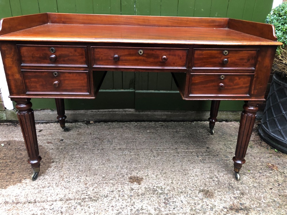 Early C19th George IV period mahogany kneehole writing table in the manner of Gillows of Lancaster and London. View X