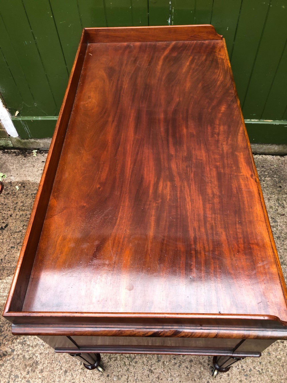 Early C19th George IV period mahogany kneehole writing table in the manner of Gillows of Lancaster and London. View XVII