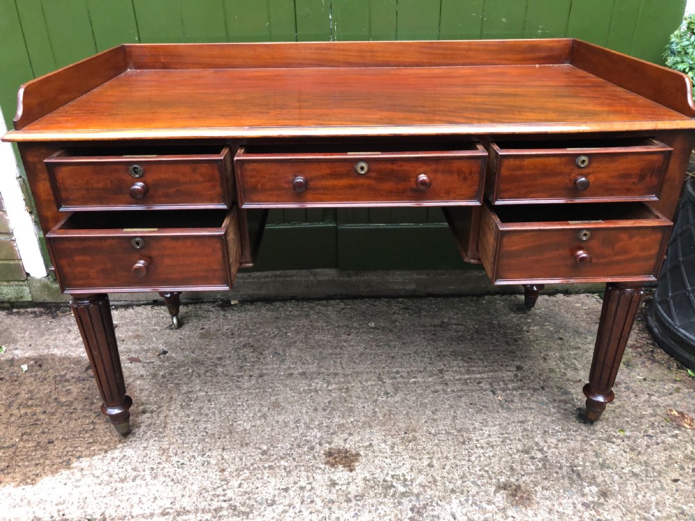 Early C19th George IV period mahogany kneehole writing table in the manner of Gillows of Lancaster and London. View XVIII