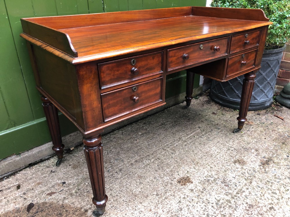 Early C19th George IV period mahogany kneehole writing table in the manner of Gillows of Lancaster and London. View XIX