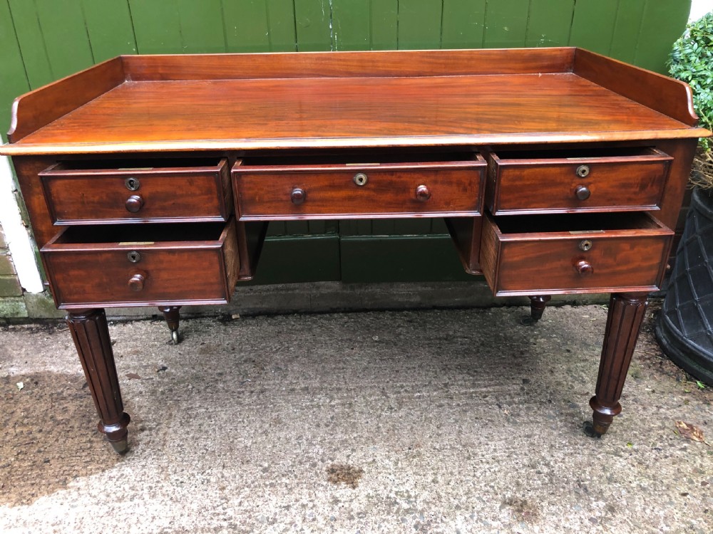 Early C19th George IV period mahogany kneehole writing table in the manner of Gillows of Lancaster and London. View XXI