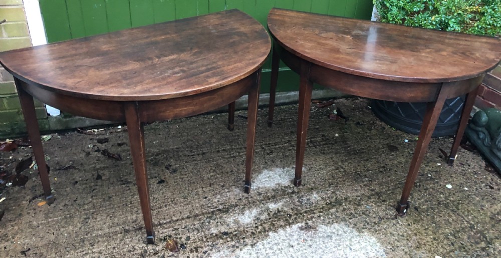 Pair of C18th George III period Cuban mahogany demi-lune tables . View II