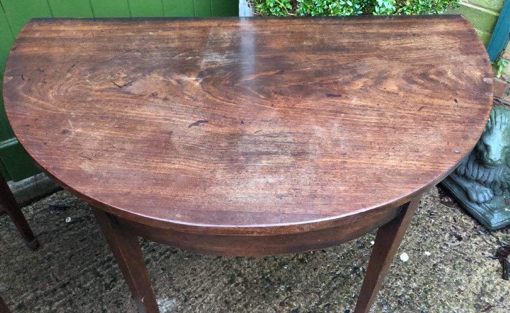 Pair of C18th George III period Cuban mahogany demi-lune tables . View III
