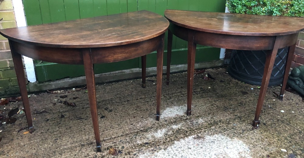 Pair of C18th George III period Cuban mahogany demi-lune tables . View V