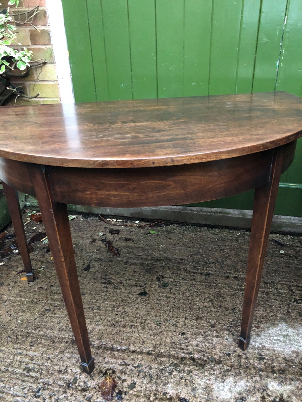 Pair of C18th George III period Cuban mahogany demi-lune tables . View VI