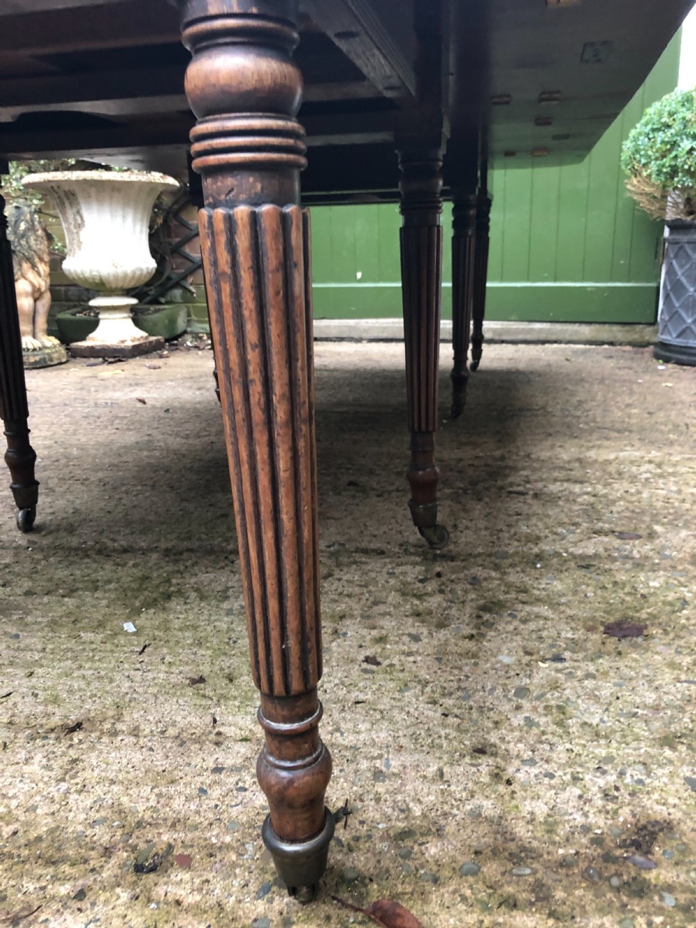 Early C19th late George III period mahogany extending dining table of unusual format . View VI