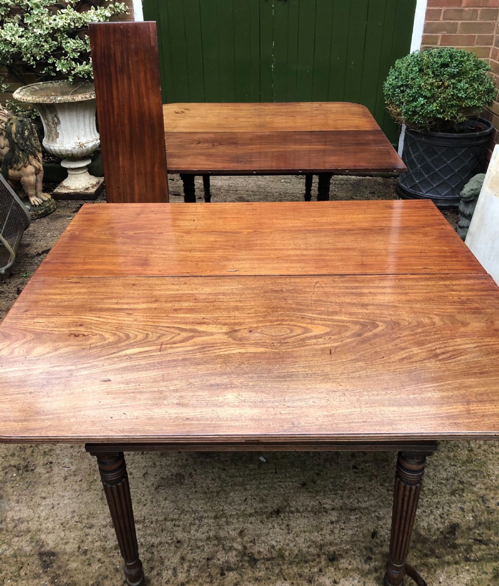 Early C19th late George III period mahogany extending dining table of unusual format . View VII