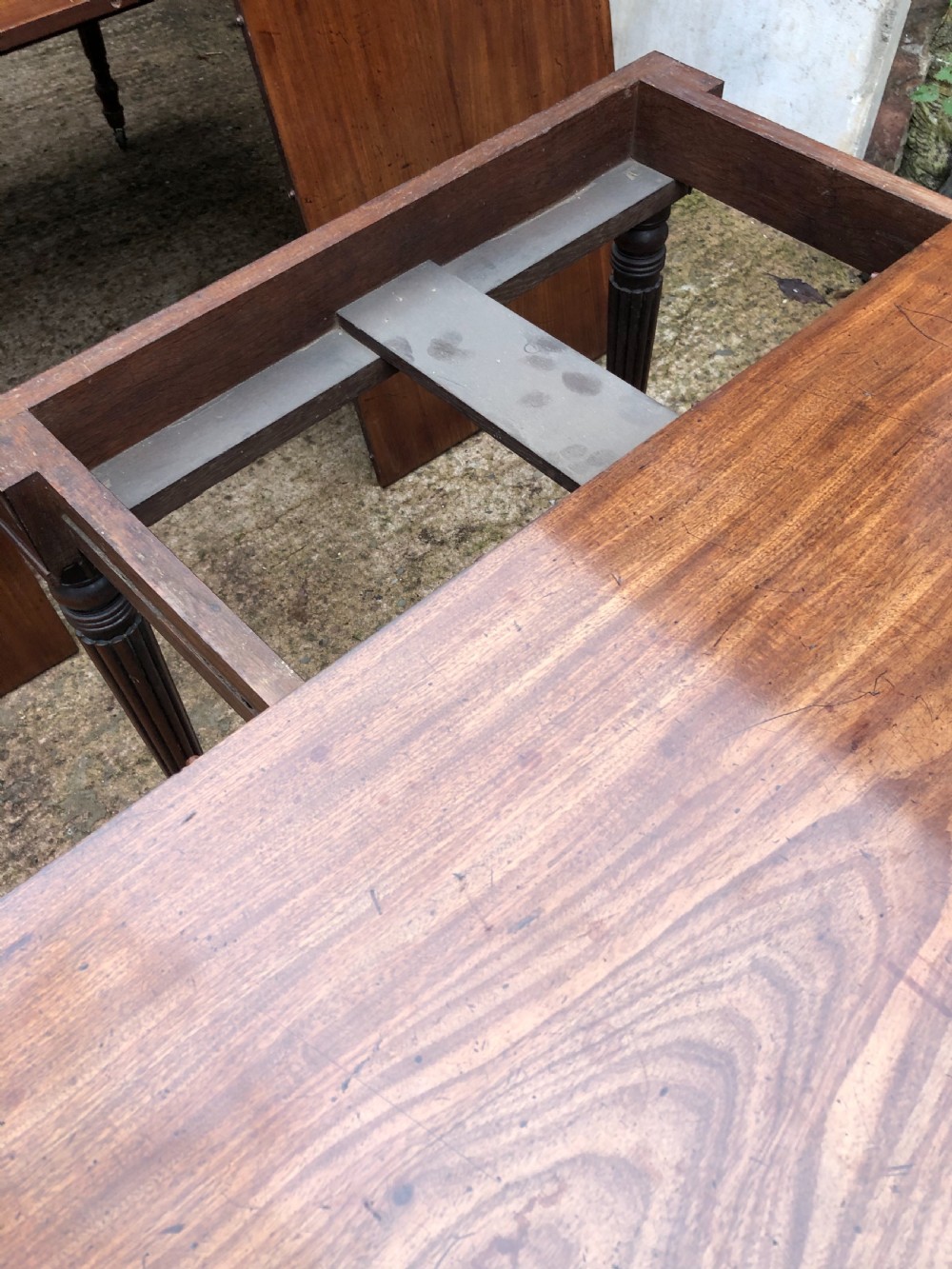 Early C19th late George III period mahogany extending dining table of unusual format . View VIII