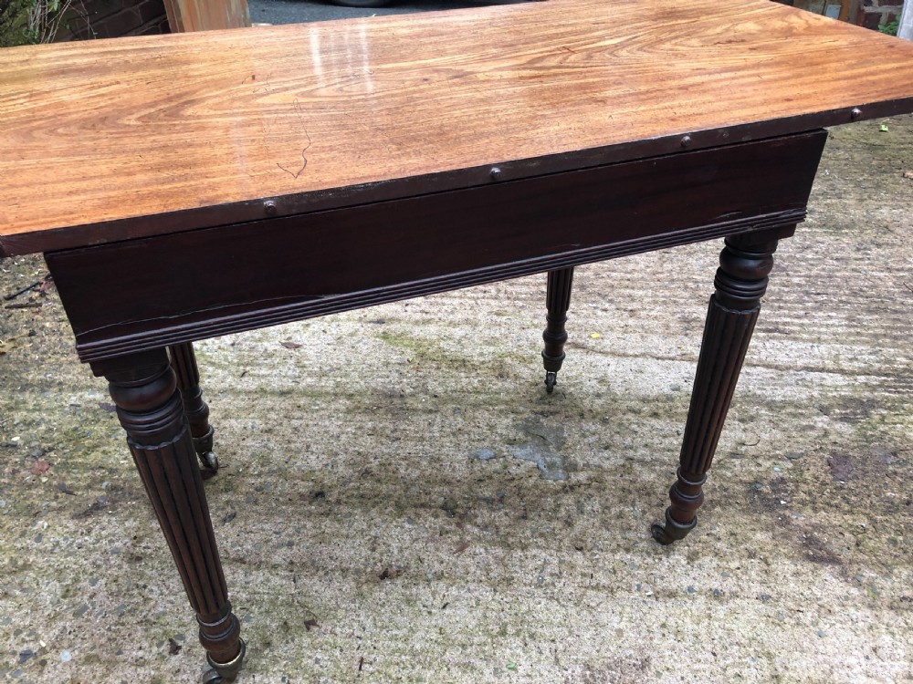 Early C19th late George III period mahogany extending dining table of unusual format . View IX