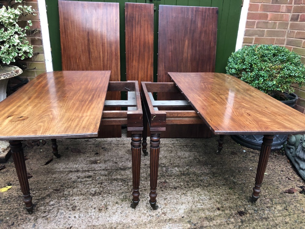 Early C19th late George III period mahogany extending dining table of unusual format . View XII