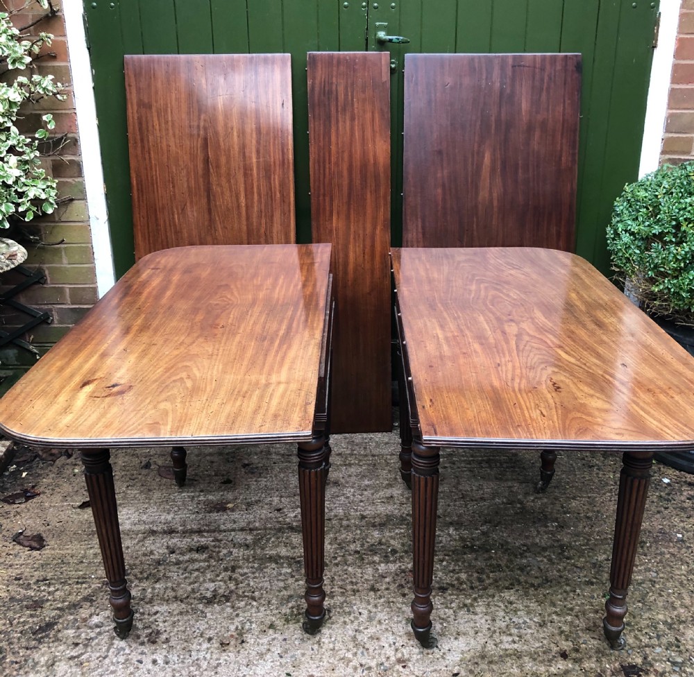 Early C19th late George III period mahogany extending dining table of unusual format . View XIII
