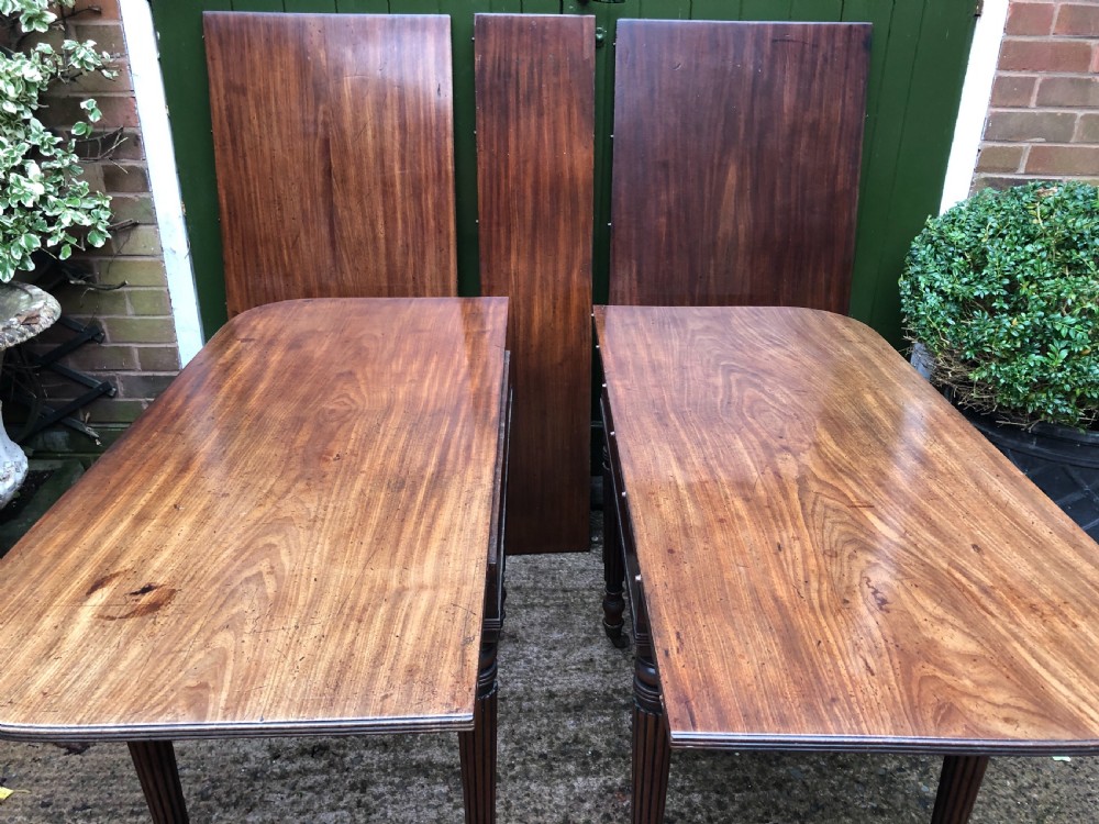 Early C19th late George III period mahogany extending dining table of unusual format . View XIV