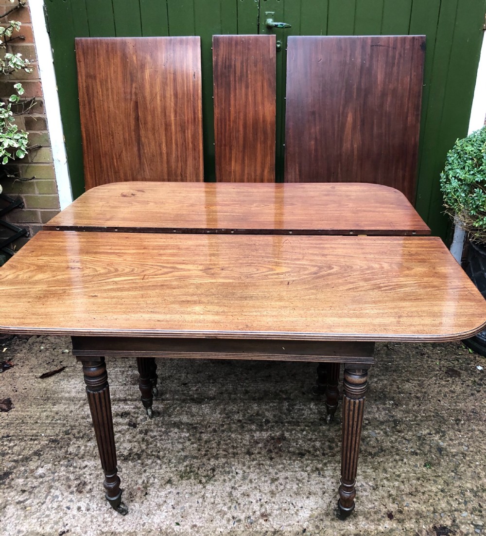 Early C19th late George III period mahogany extending dining table of unusual format . View XV