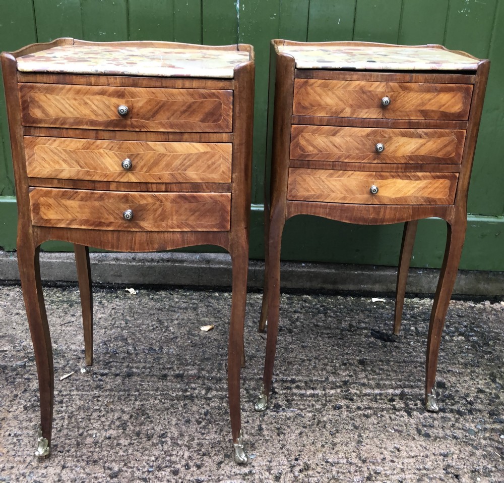 Pair of early C20th French kingwood bedside table with marble tops .