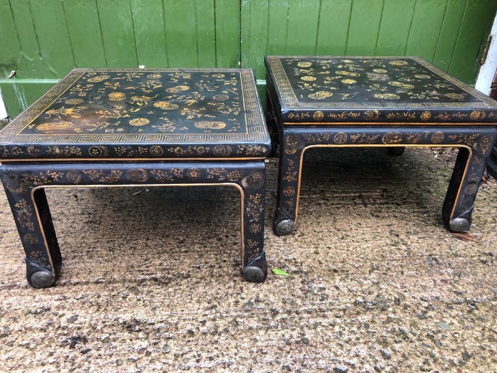 Pair of early C20th Japanese black and gilt lacquer square low tables .