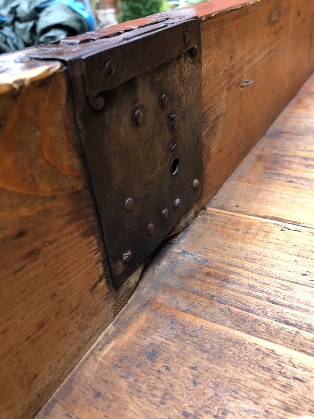 A late eighteenth-century Continental walnut commode chest featuring four long drawers with brass handles and brass escutcheons. View IX