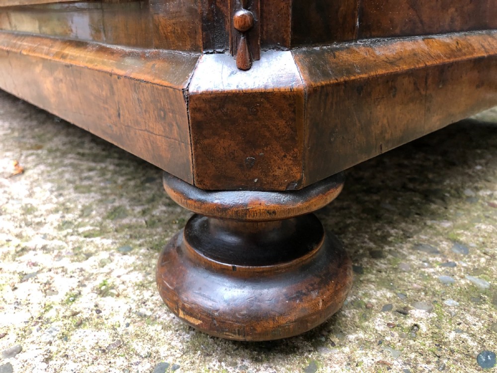 A late eighteenth-century Continental walnut commode chest featuring four long drawers with brass handles and brass escutcheons. View XVII