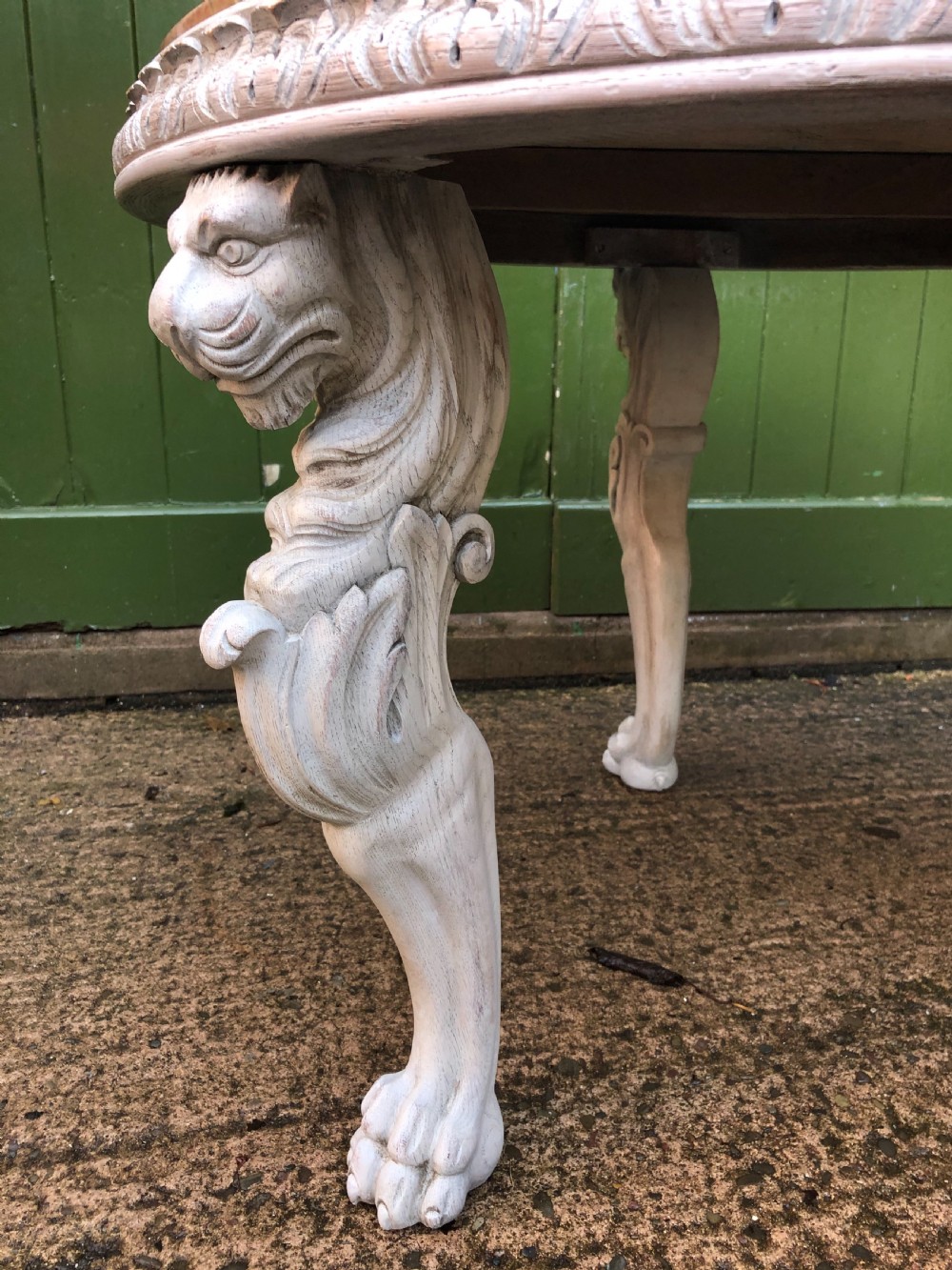 Late C19th decorated circular carved carved table with marble top on ancient Roman style lion monopodia supports. View IV