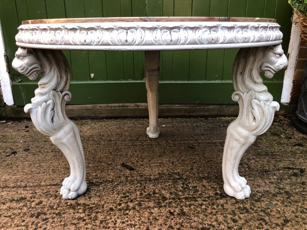 Late C19th decorated circular carved carved table with marble top on ancient Roman style lion monopodia supports. View V