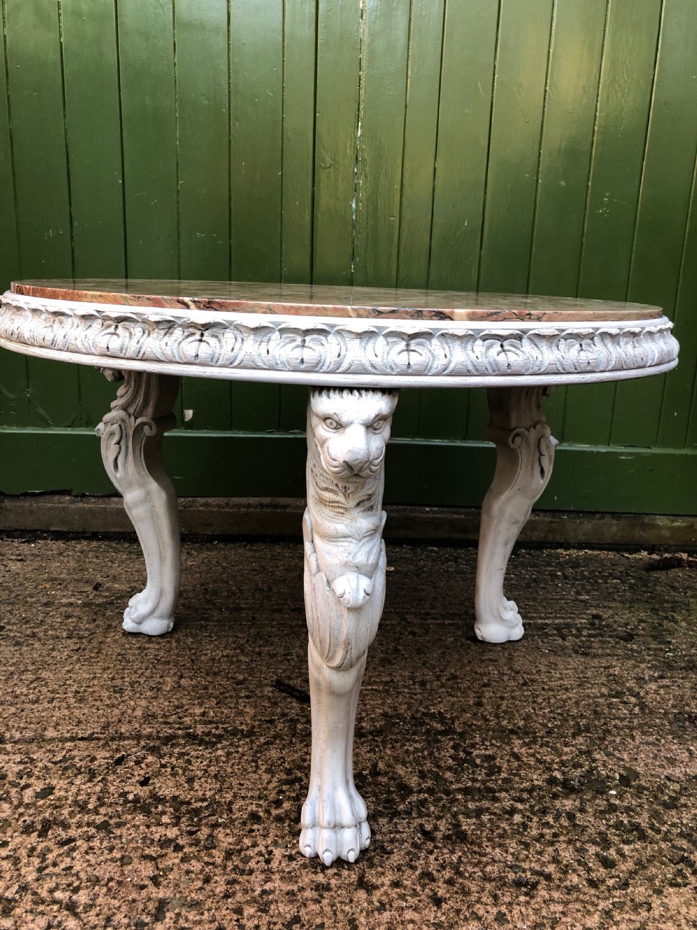 Late C19th decorated circular carved carved table with marble top on ancient Roman style lion monopodia supports. View IX