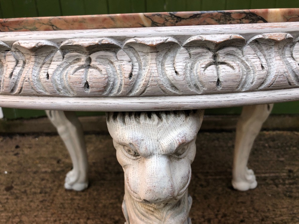 Late C19th decorated circular carved carved table with marble top on ancient Roman style lion monopodia supports. View XII