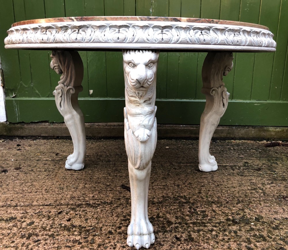 Late C19th decorated circular carved carved table with marble top on ancient Roman style lion monopodia supports. View XIII