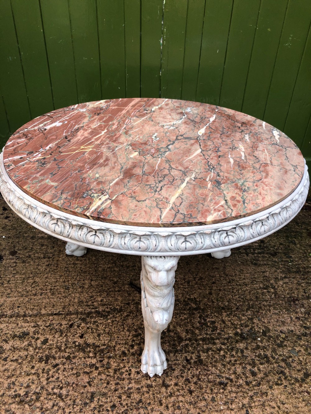 Late C19th decorated circular carved carved table with marble top on ancient Roman style lion monopodia supports. View XV