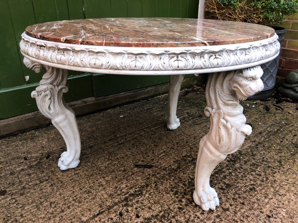 Late C19th decorated circular carved carved table with marble top on ancient Roman style lion monopodia supports. View XVI