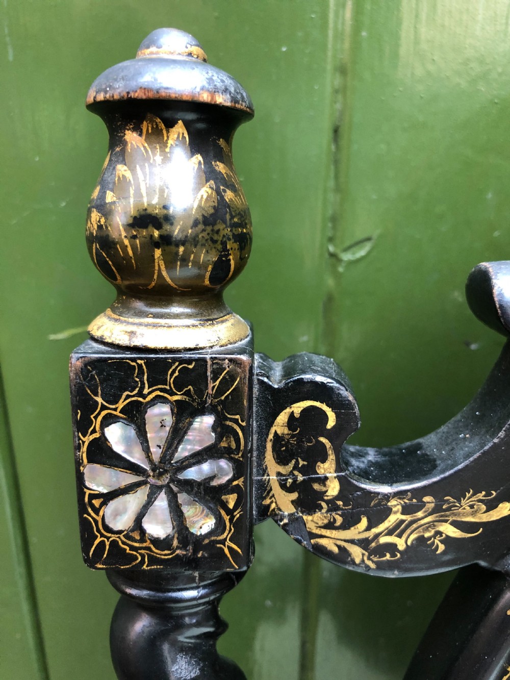 A pair of black lacquered Victorian bedroom chairs featuring oval back panels painted with floral motifs, mother-of-pearl inlay, barley twist legs, and light green upholstered seats. View XIV