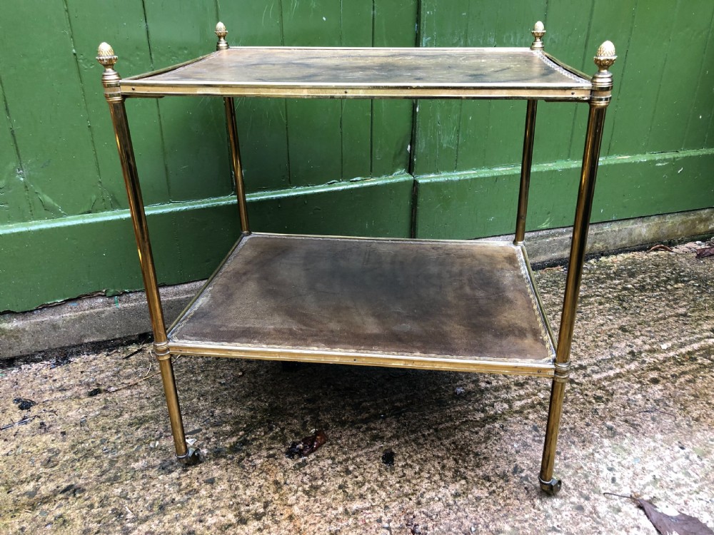 Early C20th brass-framed 2-tier rectangular etagere with tooled leather shelves .
