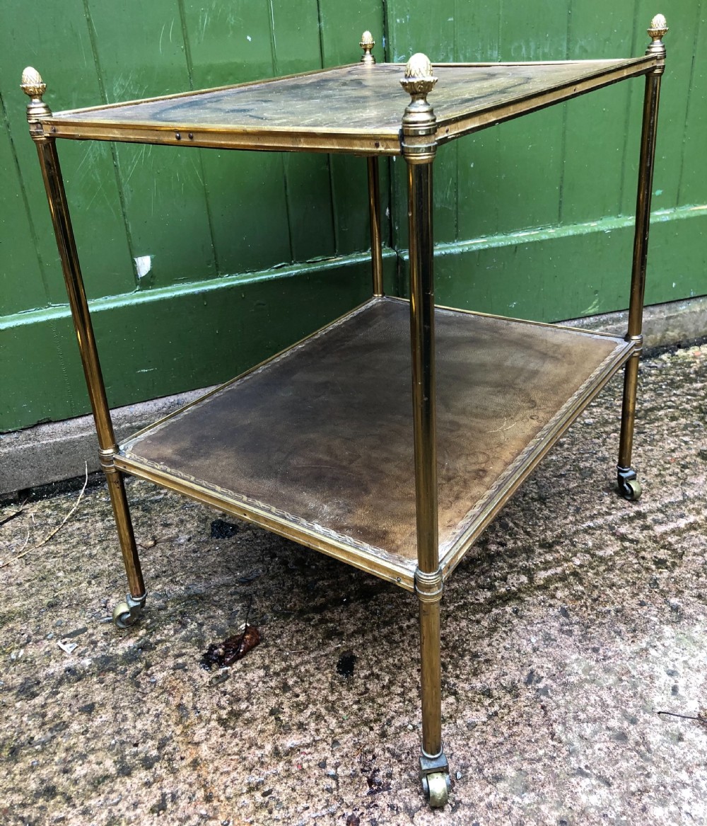 Early C20th brass-framed 2-tier rectangular etagere with tooled leather shelves . View X