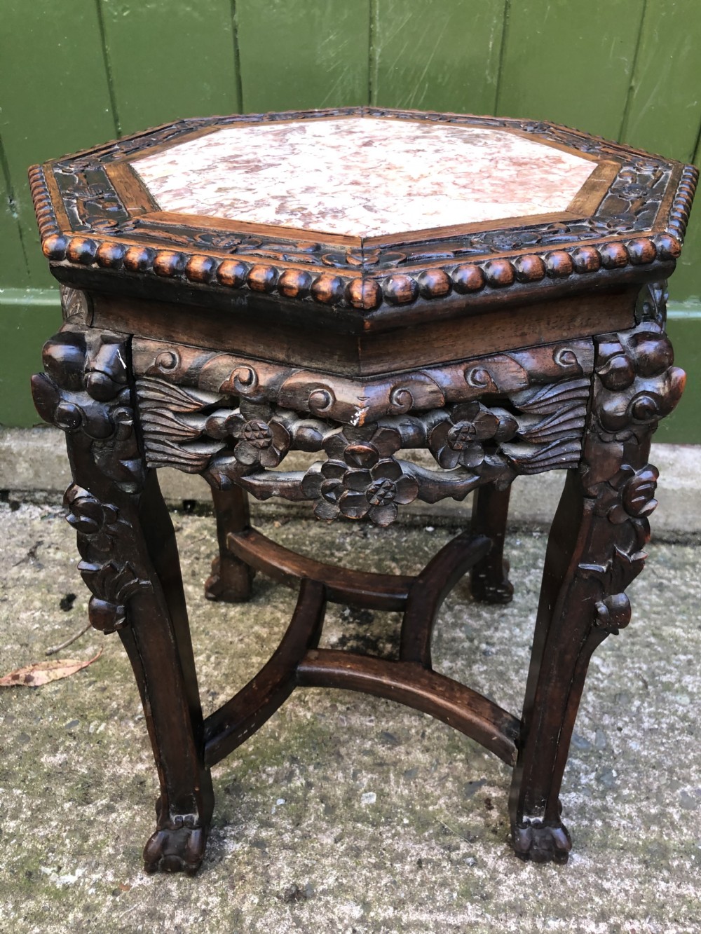 Late C19th Chinese Qing Dynasty carved hardwood inset rouge marble top low stand .