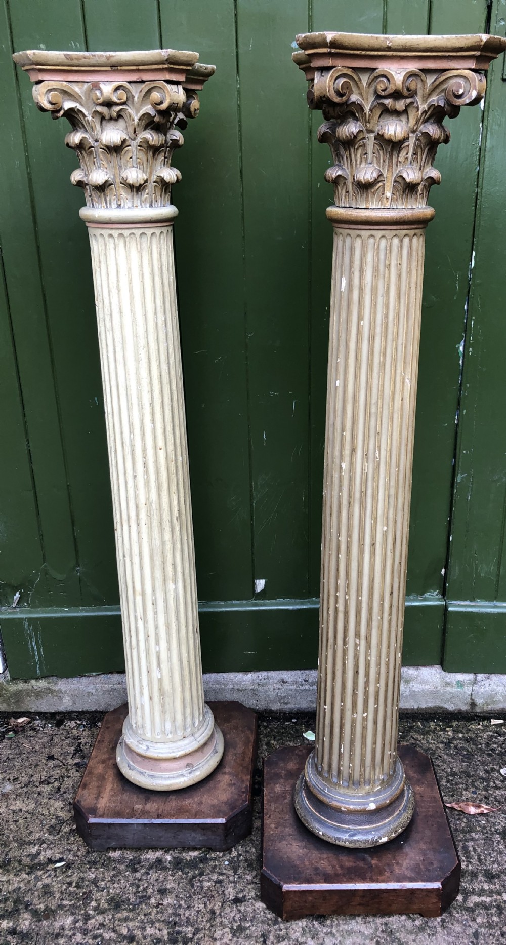 Pair of decorated early C19th carved wooden classical fluted columns with Corinthian capitals .