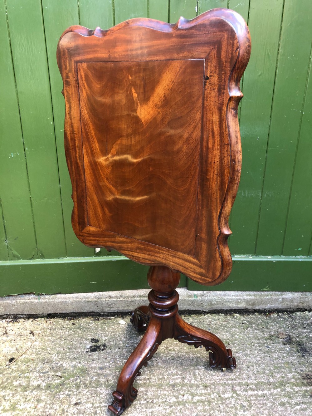 Mid C19th mahogany table with shaped top on carved tripod base in the manner of Gillows of Lancaster. View XII